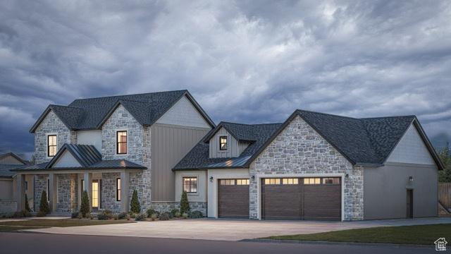 view of front of house with an attached garage, a standing seam roof, and metal roof