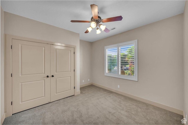 699 E Lost Dr, Washington, UT 84780 - unfurnished bedroom with a closet, a ceiling fan, visible vents, carpet, and baseboards