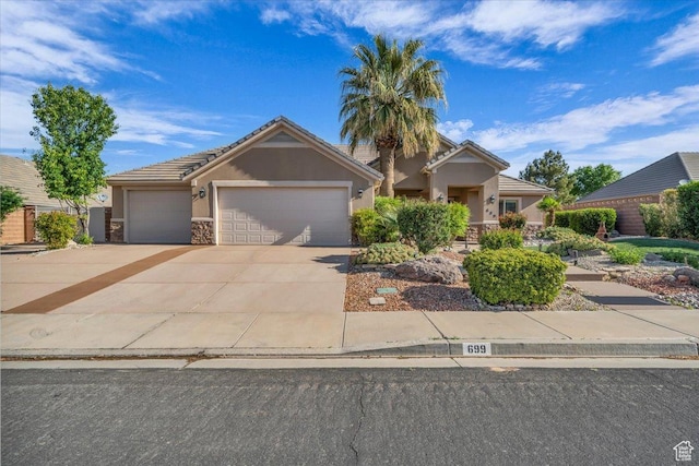 ranch-style home with a garage, stucco siding, driveway, and stone siding