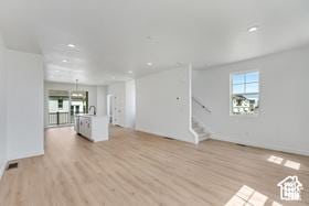 unfurnished living room featuring light hardwood / wood-style floors