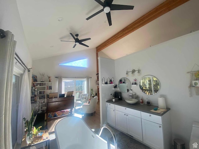 45450 W Cedar Rock Rd, Fruitland, UT 84027 - interior space featuring dark countertops, ceiling fan, and lofted ceiling with beams