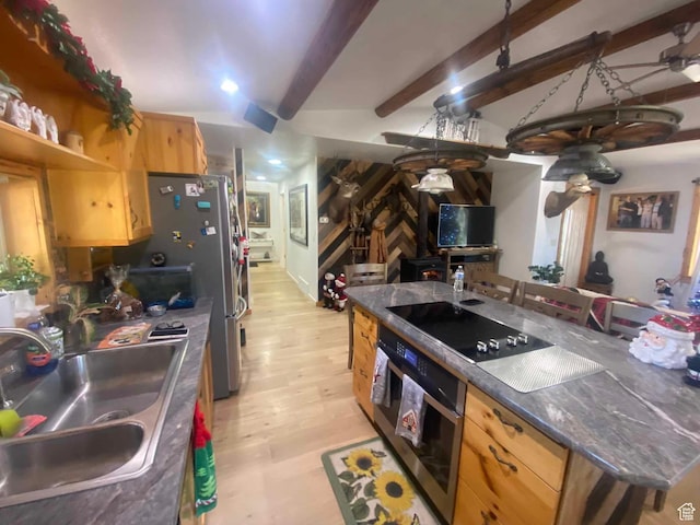 45450 W Cedar Rock Rd, Fruitland, UT 84027 - kitchen with beam ceiling, light wood finished floors, dark countertops, appliances with stainless steel finishes, and a sink