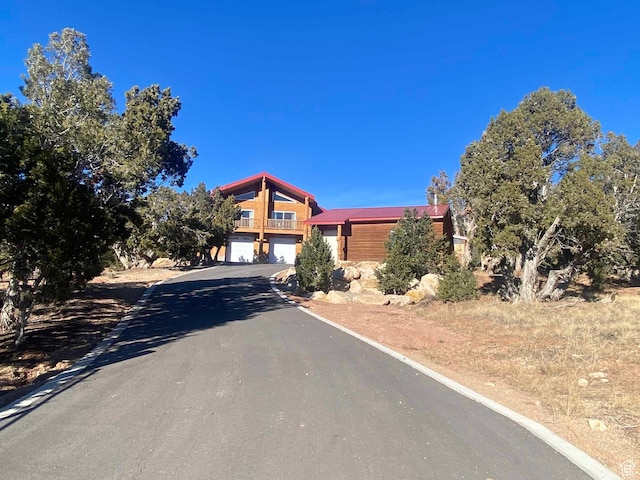45450 W Cedar Rock Rd, Fruitland, UT 84027 - view of front of home featuring aphalt driveway and an attached garage