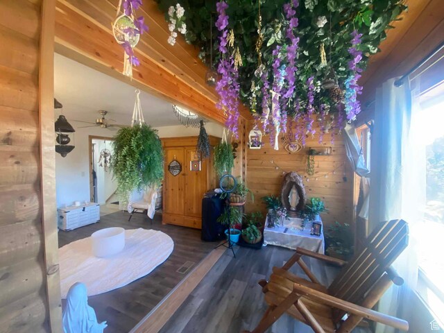 45450 W Cedar Rock Rd, Fruitland, UT 84027 - dining area featuring ceiling fan, wood walls, beamed ceiling, and wood finished floors