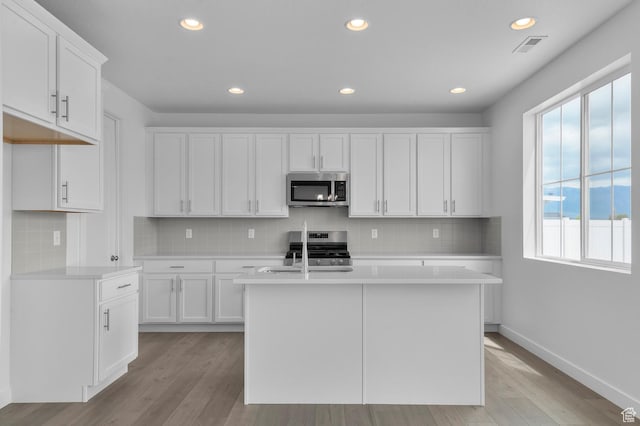 1972 S 2475 W, West Haven, UT 84401 - kitchen with stainless steel appliances, plenty of natural light, light countertops, light wood finished floors, and recessed lighting
