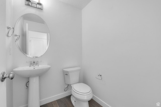 1972 S 2475 W, West Haven, UT 84401 - half bath with wood finished floors, toilet, baseboards, and a sink