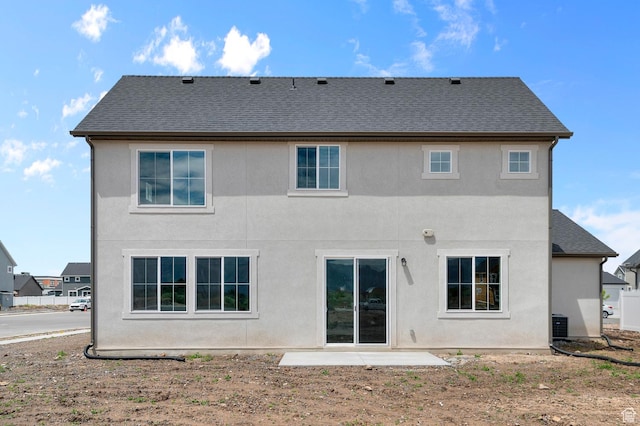 1972 S 2475 W, West Haven, UT 84401 - back of house featuring stucco siding, roof with shingles, and central air condition unit
