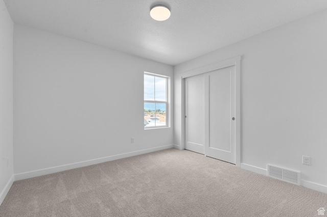 1972 S 2475 W, West Haven, UT 84401 - unfurnished bedroom with carpet flooring, baseboards, and a closet