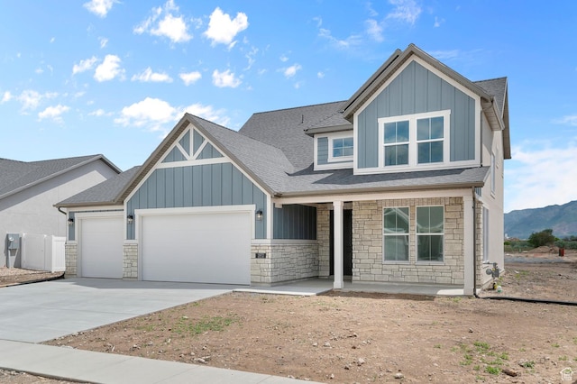 1972 S 2475 W, West Haven, UT 84401 - view of front of house with stone siding, board and batten siding, a garage, and covered porch