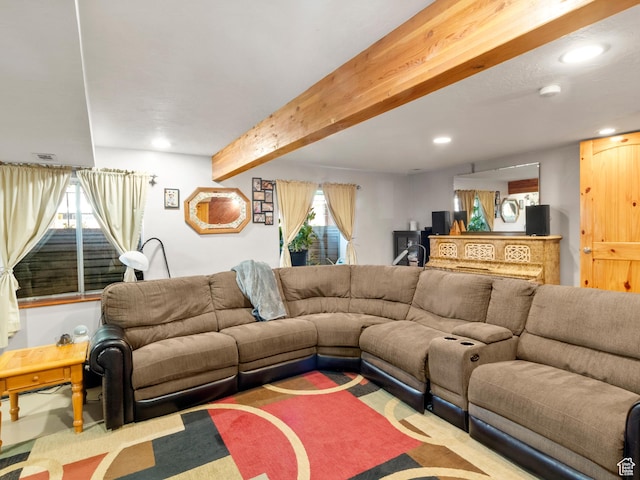 living area with beamed ceiling and recessed lighting