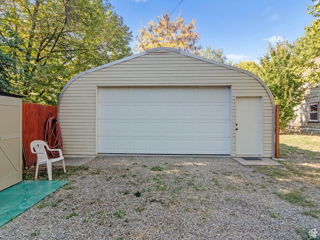 detached garage with fence