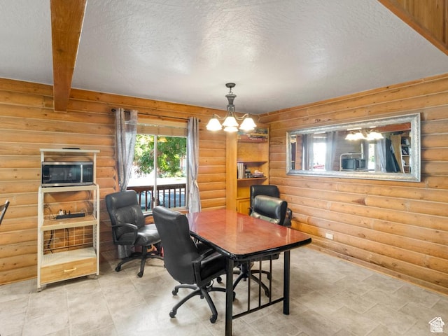 office space with log walls, beam ceiling, a notable chandelier, and a textured ceiling