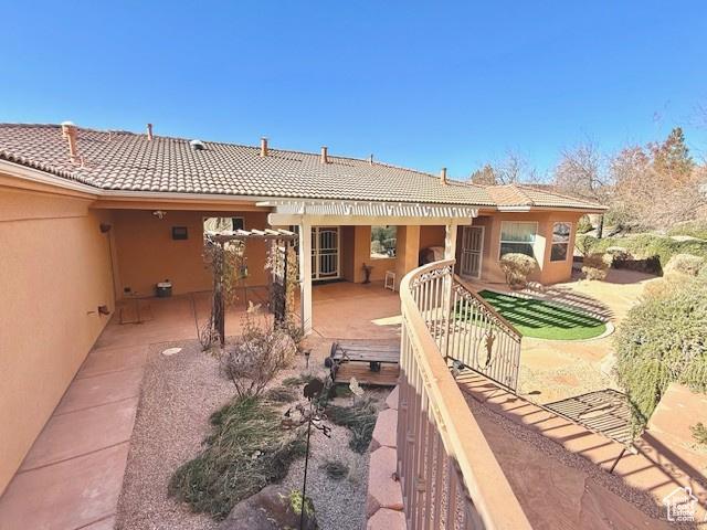 865 Seminole Way S, Washington, UT 84780 - rear view of property featuring a patio, stucco siding, and a tile roof