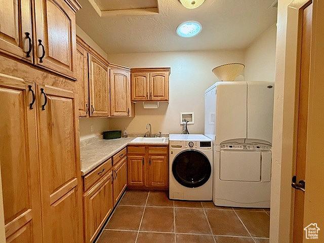 865 Seminole Way S, Washington, UT 84780 - laundry area featuring a sink, a textured ceiling, cabinet space, washer and clothes dryer, and tile patterned flooring