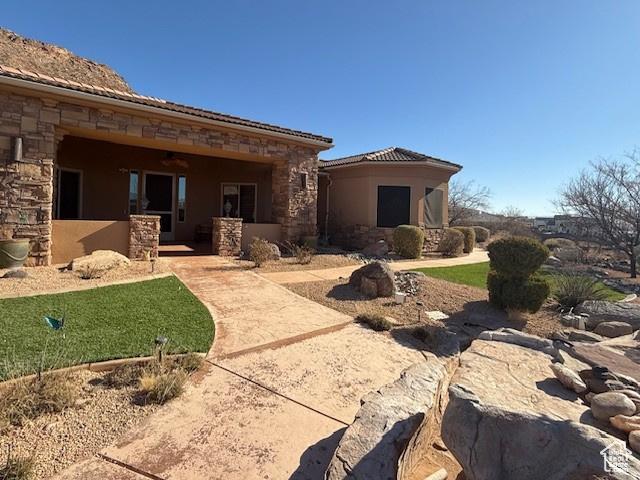 865 Seminole Way S, Washington, UT 84780 - back of property with stucco siding, stone siding, and a tile roof