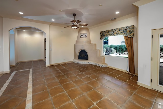 865 Seminole Way S, Washington, UT 84780 - unfurnished living room with visible vents, arched walkways, a ceiling fan, recessed lighting, and tile patterned flooring