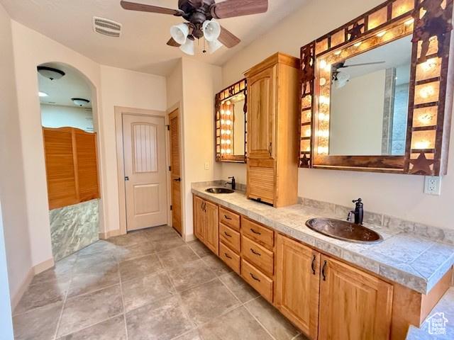 865 Seminole Way S, Washington, UT 84780 - full bathroom featuring double vanity, a sink, a ceiling fan, and visible vents