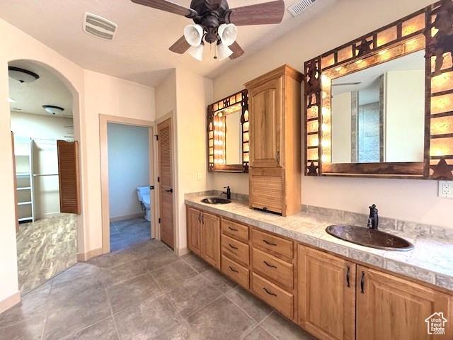 865 Seminole Way S, Washington, UT 84780 - bathroom with visible vents, a sink, and ceiling fan