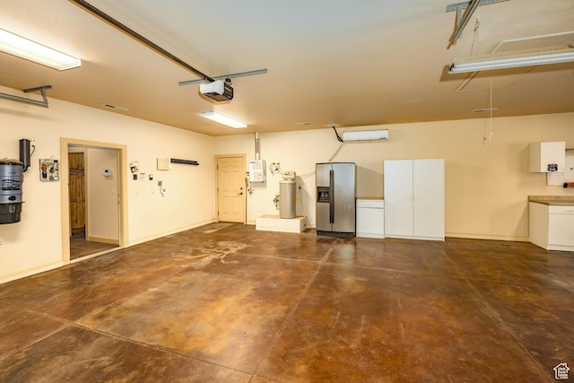 865 Seminole Way S, Washington, UT 84780 - garage featuring stainless steel fridge with ice dispenser, baseboards, and a garage door opener
