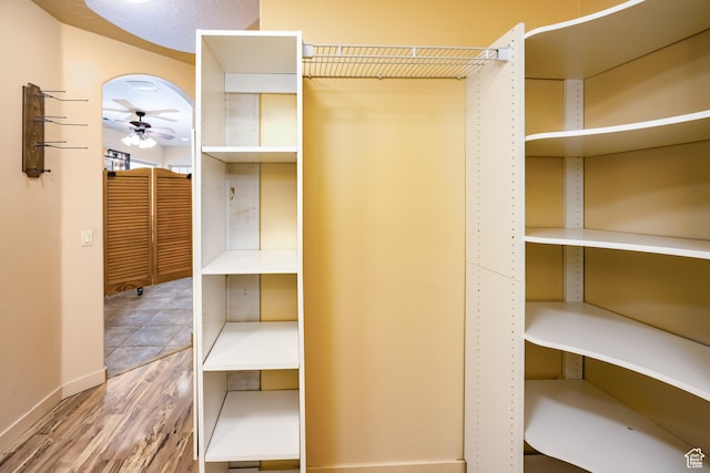 865 Seminole Way S, Washington, UT 84780 - walk in closet featuring a ceiling fan and wood finished floors