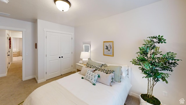 bedroom with carpet floors and a closet