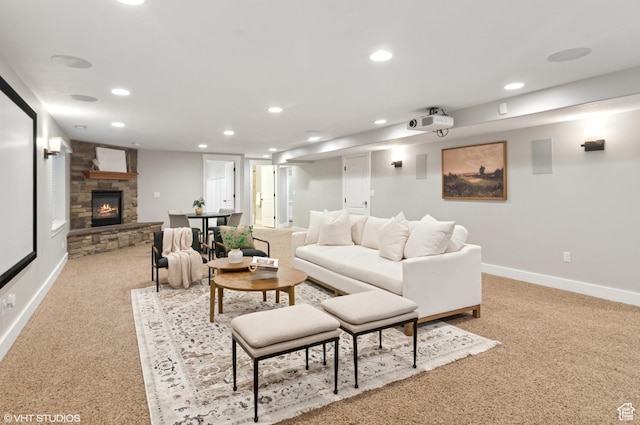 672 W 1900 S, Syracuse, UT 84075 - living room featuring a stone fireplace, recessed lighting, light colored carpet, and baseboards