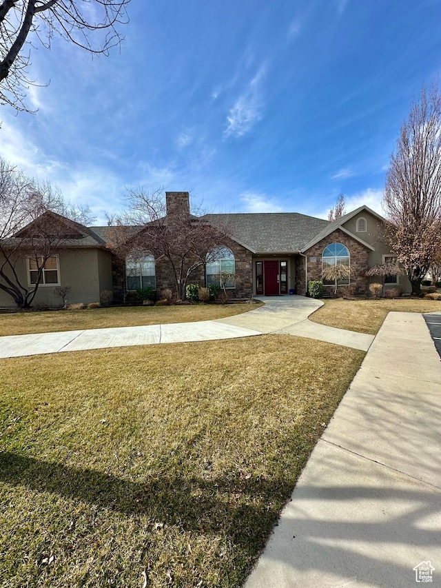 131 S 1900 W Unit U2, Lehi, UT 84043 - view of front facade featuring concrete driveway and a front lawn