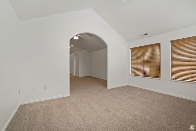 131 S 1900 W Unit U2, Lehi, UT 84043 - unfurnished room featuring arched walkways, light colored carpet, baseboards, and vaulted ceiling