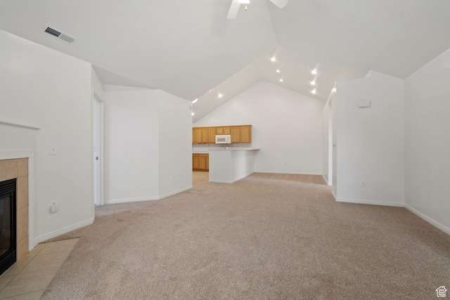 131 S 1900 W Unit U2, Lehi, UT 84043 - unfurnished living room featuring vaulted ceiling, a fireplace, visible vents, and baseboards