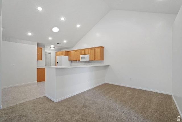 131 S 1900 W Unit U2, Lehi, UT 84043 - kitchen featuring white appliances, high vaulted ceiling, a peninsula, light countertops, and light carpet