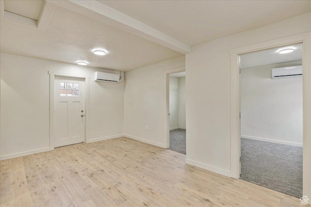 670 16th St, Ogden, UT 84404 - interior space with light hardwood / wood-style flooring and a wall mounted air conditioner