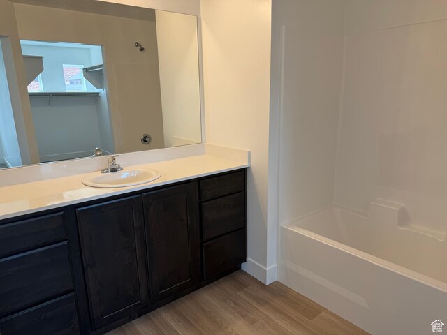 1949 S Freestone Blvd Unit 417, Santaquin, UT 84655 - bathroom with wood finished floors, vanity, shower / washtub combination, and baseboards