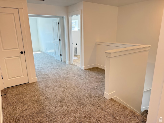 1949 S Freestone Blvd Unit 417, Santaquin, UT 84655 - hallway featuring carpet floors, baseboards, and an upstairs landing