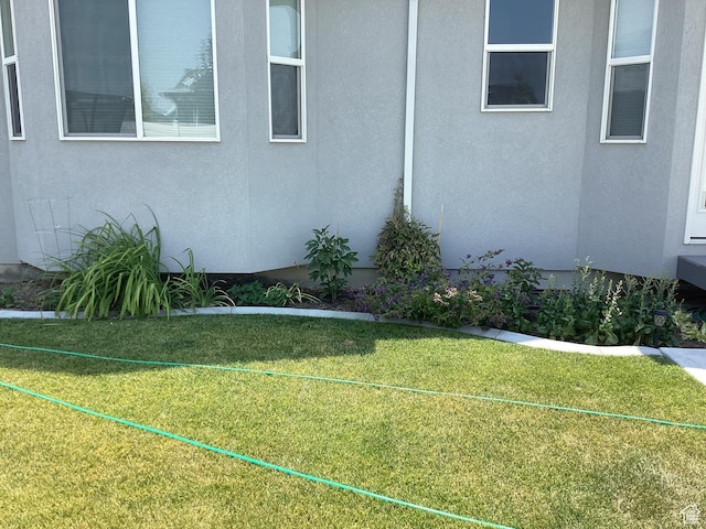 263 E Somerest Ln N, Stansbury Park, UT 84074 - view of side of home with a lawn