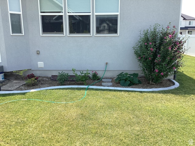 263 E Somerest Ln N, Stansbury Park, UT 84074 - view of side of home with a yard