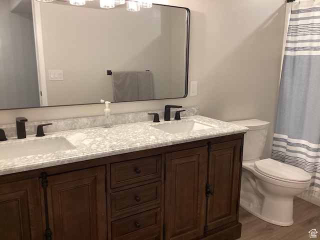 263 E Somerest Ln N, Stansbury Park, UT 84074 - bathroom featuring toilet, vanity, hardwood / wood-style floors, and a shower with shower curtain