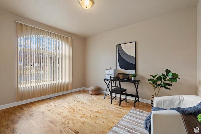 office area with hardwood / wood-style flooring