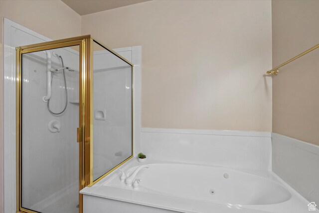 bathroom featuring plus walk in shower