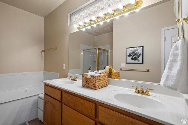 bathroom featuring separate shower and tub and vanity