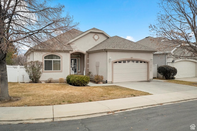 single story home with a front lawn and a garage