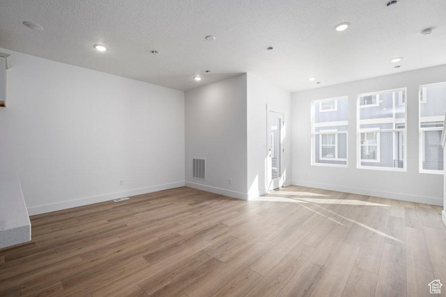 1773 W 160 S Unit 43, Pleasant Grove, UT 84062 - unfurnished room with light wood-type flooring, visible vents, a textured ceiling, recessed lighting, and baseboards