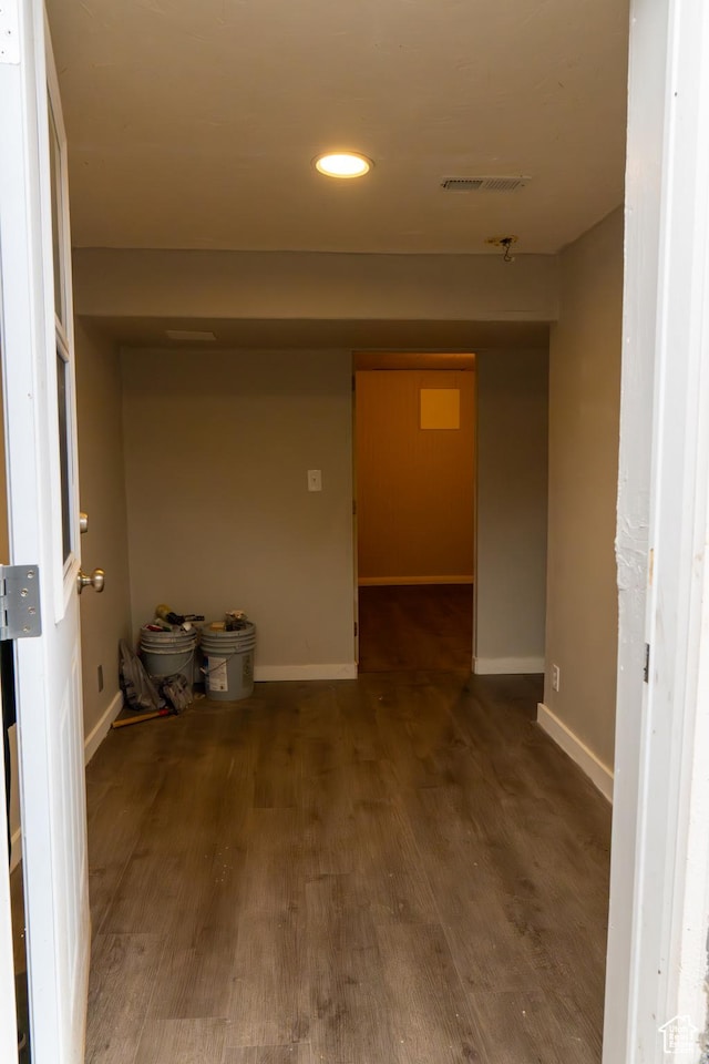 hallway featuring dark wood-type flooring