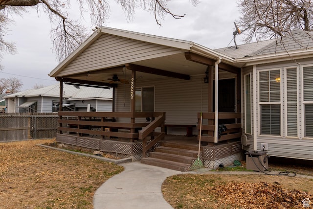 entrance to property featuring ceiling fan