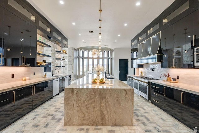 2836 S 2300th Cir E, St George, UT 84790 - kitchen featuring stainless steel appliances, decorative backsplash, a sink, dark cabinets, and exhaust hood