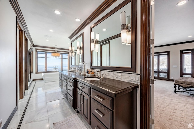 2845 S Wood Hollow Way, Bountiful, UT 84010 - full bath featuring crown molding, baseboards, a freestanding tub, plenty of natural light, and tasteful backsplash
