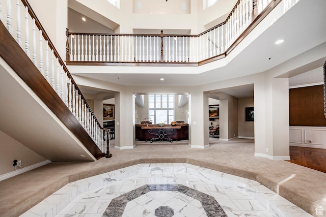 2845 S Wood Hollow Way, Bountiful, UT 84010 - entryway featuring baseboards, stairway, inlaid floor details, a towering ceiling, and recessed lighting