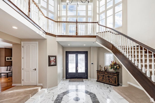 2845 S Wood Hollow Way, Bountiful, UT 84010 - foyer entrance featuring a high ceiling, a chandelier, french doors, stairs, and baseboards