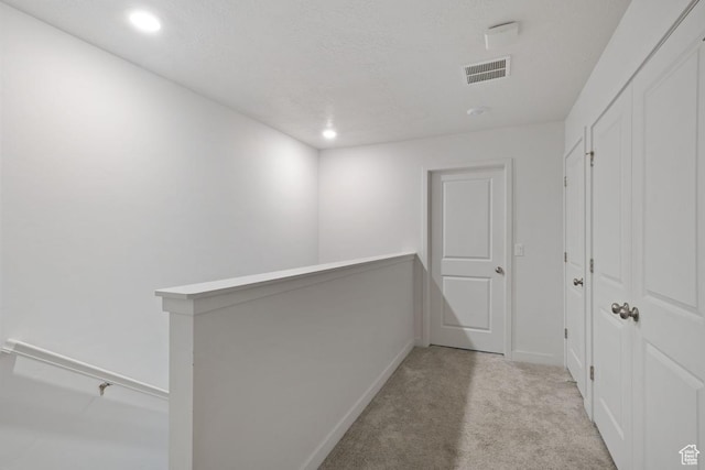 3788 W Soft Whisper Way, Herriman, UT 84096 - hallway featuring a textured ceiling and light colored carpet