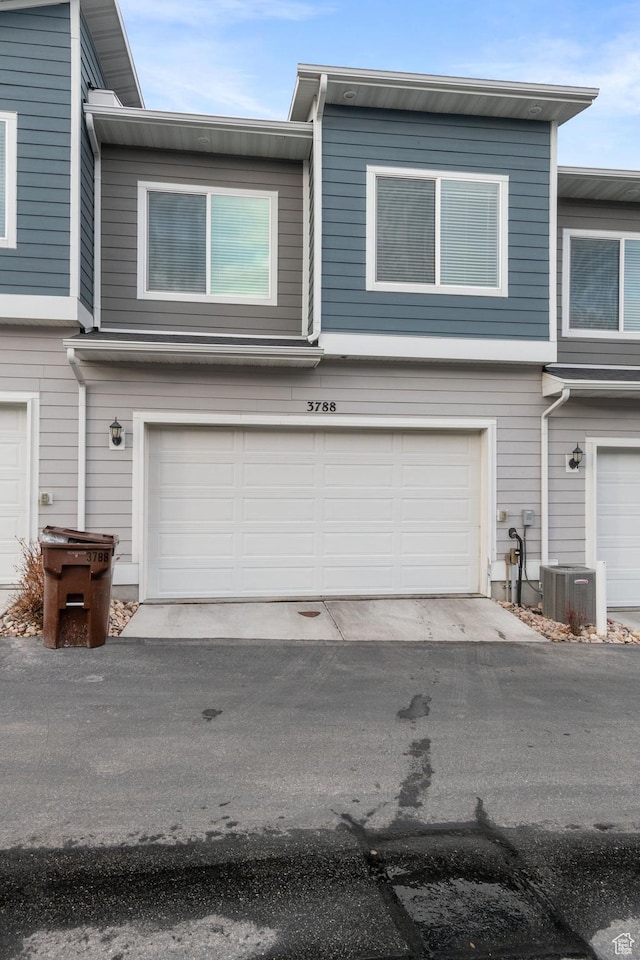 3788 W Soft Whisper Way, Herriman, UT 84096 - view of front of house with central air condition unit and a garage