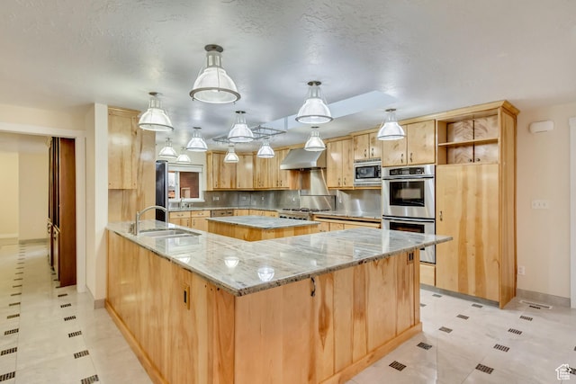 3780 W 5850 S, Roy, UT 84067 - kitchen featuring hanging light fixtures, wall chimney exhaust hood, stainless steel appliances, light stone countertops, and kitchen peninsula